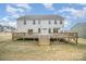 Expansive backyard with a multi-level wooden deck, ideal for gatherings and relaxation at 4604 Howie Ln, Harrisburg, NC 28075