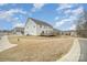 Large backyard with a wooden deck, perfect for outdoor entertaining at 4604 Howie Ln, Harrisburg, NC 28075