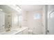 Beautiful bathroom with double sinks, a large mirror, and a tiled shower at 4604 Howie Ln, Harrisburg, NC 28075