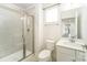 Modern bathroom with a glass-enclosed shower, white vanity, and contemporary fixtures at 4604 Howie Ln, Harrisburg, NC 28075