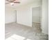 Bright bedroom with plush carpet, double windows offering natural light, and an en-suite closet at 4604 Howie Ln, Harrisburg, NC 28075