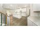 Open kitchen featuring white cabinets, an island, pendant lighting, marble backsplash and stainless steel appliances at 4604 Howie Ln, Harrisburg, NC 28075