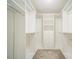 Spacious walk-in closet with built-in shelving, drawers, and ample hanging space at 4604 Howie Ln, Harrisburg, NC 28075
