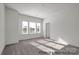 Spacious bedroom with large windows, plush carpeting, and neutral decor, creating a relaxing atmosphere at 459 Shasta St # 5102, Gastonia, NC 28052