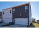 Modern townhome featuring a two-car garage and sleek, two-toned siding at 459 Shasta St # 5102, Gastonia, NC 28052