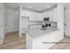 Modern kitchen with white cabinetry, granite countertops, stainless steel appliances, and an island at 459 Shasta St # 5102, Gastonia, NC 28052