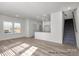Open floor plan with hardwood floors and lots of natural light coming in from the multiple windows at 459 Shasta St # 5102, Gastonia, NC 28052