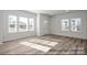 Bright living room boasts large windows, providing abundant natural light and highlighting the hardwood floors at 459 Shasta St # 5102, Gastonia, NC 28052