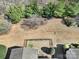 Aerial view of backyard with fenced in yard and mature trees at 52194 Longspur Ln, Fort Mill, SC 29707