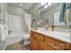 Bright bathroom featuring a tub-shower combo, vanity and tile flooring at 52194 Longspur Ln, Fort Mill, SC 29707
