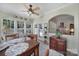 Bright breakfast nook featuring an outdoor view, wood table set, and access to outdoor patio at 52194 Longspur Ln, Fort Mill, SC 29707