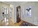 Inviting foyer with hardwood floors, traditional décor, and a charming grandfather clock at 52194 Longspur Ln, Fort Mill, SC 29707