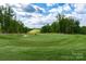 Beautiful golf course view with green grass, blue skies and mature trees at 52194 Longspur Ln, Fort Mill, SC 29707