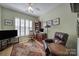 Home office featuring hardwood floors, shutters, a ceiling fan, and wood furnishings at 52194 Longspur Ln, Fort Mill, SC 29707