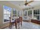 Bright sunroom features a dining area and sitting area with many windows and natural light at 52194 Longspur Ln, Fort Mill, SC 29707