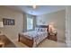 Cozy bedroom with a wooden bed frame and animal-themed decor at 5235 Reedy Ridge Rd, Charlotte, NC 28215