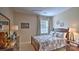 Comfortable bedroom featuring a plaid bedspread and matching curtains at 5235 Reedy Ridge Rd, Charlotte, NC 28215