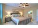 Comfortable main bedroom with a ceiling fan, bedside tables, lamps and ensuite bathroom at 5235 Reedy Ridge Rd, Charlotte, NC 28215