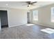 Spacious bedroom with laminate flooring, ceiling fan and bright windows at 553 Wateree St, Lancaster, SC 29720