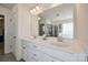 Bathroom features a double vanity with white countertop and adjacent shower with glass door at 646 Kahana River Rd, Fort Mill, SC 29715