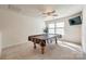 Recreation room offers ample space for a pool table and other games, perfect for entertainment at 646 Kahana River Rd, Fort Mill, SC 29715