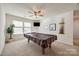 Upstairs game room featuring a pool table, natural light, and plenty of space for recreation at 646 Kahana River Rd, Fort Mill, SC 29715
