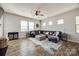 Spacious living room features a large, comfortable sectional sofa and stylish area rug at 646 Kahana River Rd, Fort Mill, SC 29715