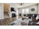 Comfortable living room with a cozy fireplace and staircase access to upper level at 646 Kahana River Rd, Fort Mill, SC 29715