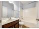 Cozy bathroom with a bathtub and shower combo, single sink vanity and neutral finishes at 8315 Bridgegate Dr, Huntersville, NC 28078