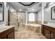 Spacious bathroom with a large walk-in shower, soaking tub and double vanity at 8315 Bridgegate Dr, Huntersville, NC 28078