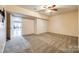 Bedroom featuring neutral carpet, ceiling fan, and a closet at 8315 Bridgegate Dr, Huntersville, NC 28078