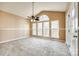 The sun room is bright with lots of windows, neutral decor, and a ceiling fan at 8315 Bridgegate Dr, Huntersville, NC 28078