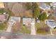Aerial view of a two-story home featuring a long driveway, a well-maintained lawn, and mature trees at 9138 Babbitt Way, Charlotte, NC 28216