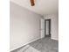 This carpeted bedroom features neutral walls and trim with a ceiling fan and access to the home's other rooms at 9138 Babbitt Way, Charlotte, NC 28216