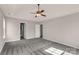 Neutral Primary bedroom with a ceiling fan, plush carpeting, and natural light from a window at 9138 Babbitt Way, Charlotte, NC 28216