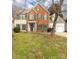 Charming two-story brick and siding home with green shutters, a well-manicured lawn, and an attached two-car garage at 9138 Babbitt Way, Charlotte, NC 28216