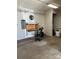 This garage is ready for projects with a workstation and plenty of light at 9138 Babbitt Way, Charlotte, NC 28216