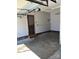 This garage features access to the home through an exterior door and a newer garage door at 9138 Babbitt Way, Charlotte, NC 28216