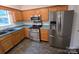 Modern kitchen equipped with stainless steel appliances and ample counter space for cooking at 9138 Babbitt Way, Charlotte, NC 28216