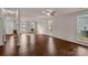 Bright, open-concept living room with hardwood floors, large windows, and an inviting atmosphere at 9138 Babbitt Way, Charlotte, NC 28216