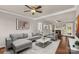 Bright living room featuring a fireplace, ample seating, and hardwood floors at 9138 Babbitt Way, Charlotte, NC 28216