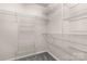 Spacious walk-in closet with wire shelving units for organized storage of clothing and accessories at 9138 Babbitt Way, Charlotte, NC 28216