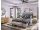 Well-lit main bedroom with tray ceiling, neutral tones, and decorative artwork above the headboard at Lot 19 Pleasant Rd, Fort Mill, SC 29708