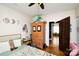 Bright bedroom featuring a wardrobe, hardwood floors, and fun decor at 101 Sunset Dr, Stanley, NC 28164