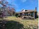 Home showcasing blooming magnolias and American flag, enhancing curb appeal at 101 Sunset Dr, Stanley, NC 28164