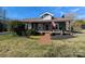Charming home featuring inviting front porch, walkway, and beautiful landscaping at 101 Sunset Dr, Stanley, NC 28164