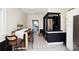 Eat-in kitchen with black and white cabinetry, adjoining laundry area at 101 Sunset Dr, Stanley, NC 28164