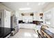 Bright eat-in kitchen with stainless steel appliances and a large window at 101 Sunset Dr, Stanley, NC 28164
