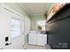 Charming laundry room featuring modern washer and dryer and ample storage at 101 Sunset Dr, Stanley, NC 28164