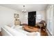 Inviting living area with hardwood floors, fireplace, neutral paint, and comfortable seating for relaxation at 101 Sunset Dr, Stanley, NC 28164